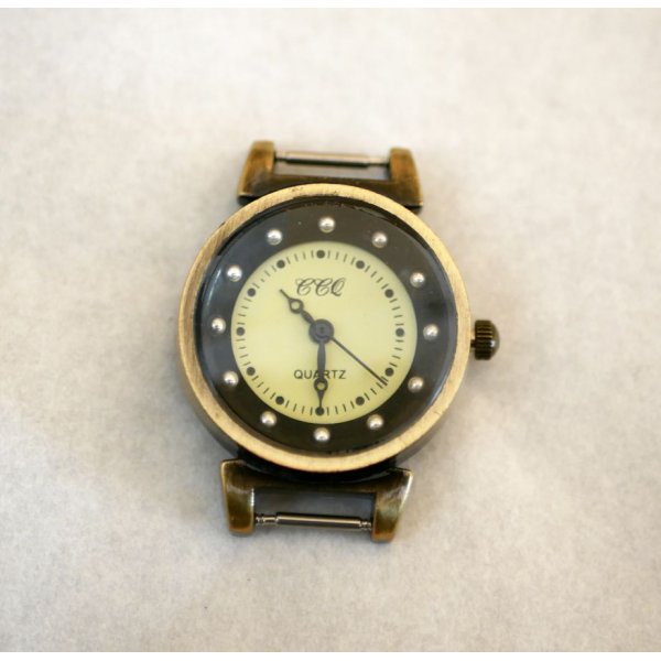 Quadrante dell'orologio a molla nero e bronzo